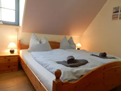 Ein Bett oder Betten in einem Zimmer der Unterkunft Eichenpark 34