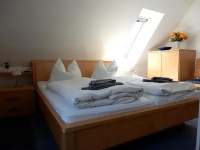 Ein Bett oder Betten in einem Zimmer der Unterkunft Eichenpark 45