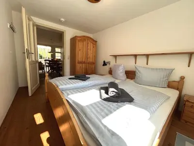 Ein Bett oder Betten in einem Zimmer der Unterkunft Eichenpark 51