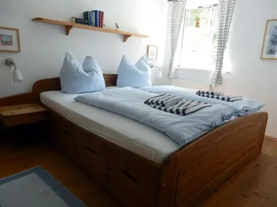 Ein Bett oder Betten in einem Zimmer der Unterkunft Eichenpark 52