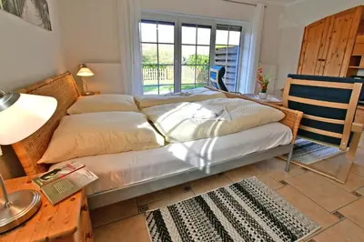 Ein Bett oder Betten in einem Zimmer der Unterkunft Zingstidyll