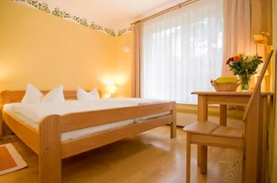 Ein Bett oder Betten in einem Zimmer der Unterkunft Hotel Haus Linden