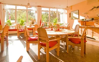 Ein Sitzbereich in der Unterkunft Hotel Haus Linden