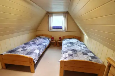 Ein Bett oder Betten in einem Zimmer der Unterkunft Fischlandhus