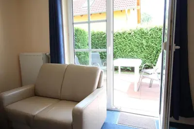 Ein Sitzbereich in der Unterkunft Boddenwelle