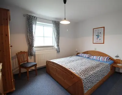 Ein Bett oder Betten in einem Zimmer der Unterkunft Haus am Bodden