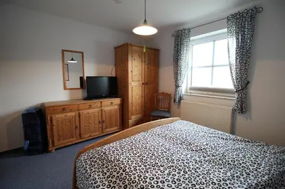 Ein Bett oder Betten in einem Zimmer der Unterkunft Haus am Bodden