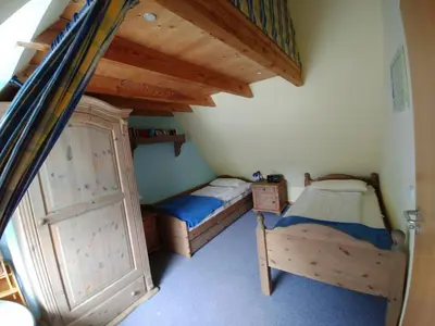 Ein Bett oder Betten in einem Zimmer der Unterkunft FeWo Abendsonne