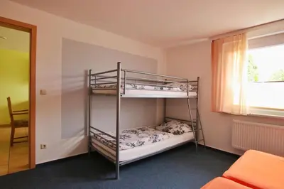 Ein Bett oder Betten in einem Zimmer der Unterkunft Pension 