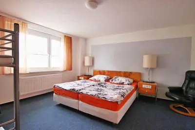 Ein Bett oder Betten in einem Zimmer der Unterkunft Pension 
