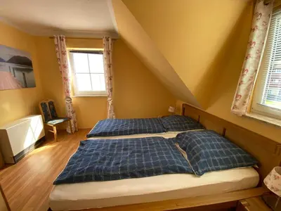 Ein Bett oder Betten in einem Zimmer der Unterkunft Haus hinter der Düne