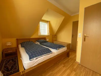 Ein Bett oder Betten in einem Zimmer der Unterkunft Haus hinter der Düne
