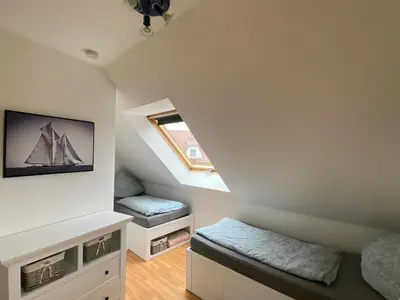 Ein Bett oder Betten in einem Zimmer der Unterkunft Haus hinter der Düne