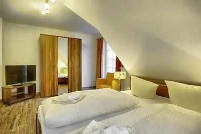Ein Bett oder Betten in einem Zimmer der Unterkunft Min Sünn
