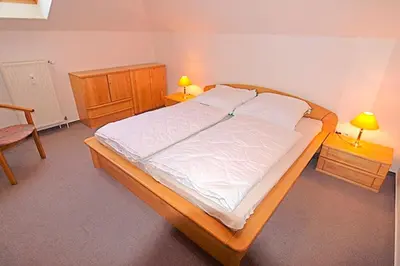 Ein Bett oder Betten in einem Zimmer der Unterkunft Residenz 