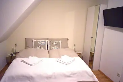 Ein Bett oder Betten in einem Zimmer der Unterkunft Ostseebrise FH 2