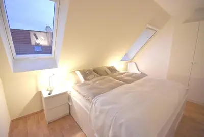 Ein Bett oder Betten in einem Zimmer der Unterkunft Ostseebrise FH 2