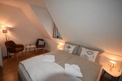 Ein Bett oder Betten in einem Zimmer der Unterkunft Ostseebrise FH 1