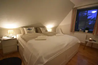 Ein Bett oder Betten in einem Zimmer der Unterkunft Ostseebrise FH 3