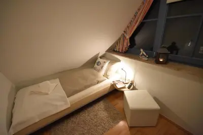 Ein Bett oder Betten in einem Zimmer der Unterkunft Ostseebrise FH 3