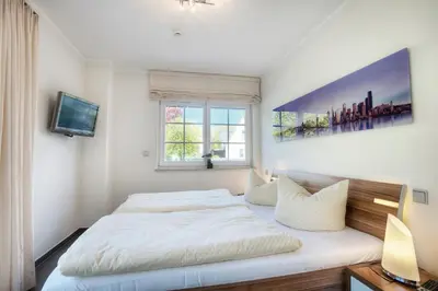 Ein Bett oder Betten in einem Zimmer der Unterkunft Deichgraf Strandresidenz 1 Ahrenshoop