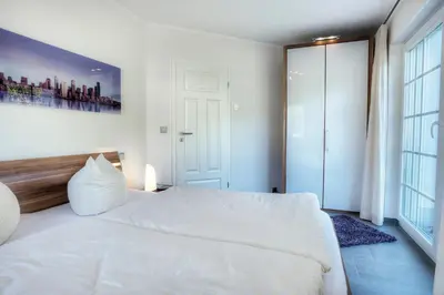 Ein Bett oder Betten in einem Zimmer der Unterkunft Deichgraf Strandresidenz 1 Ahrenshoop