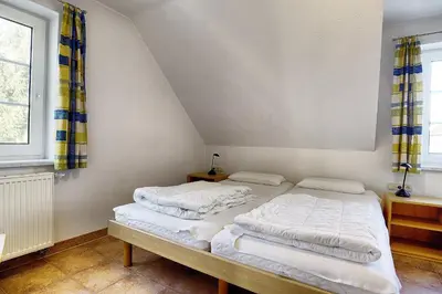 Ein Bett oder Betten in einem Zimmer der Unterkunft Ostseehaus 2