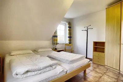 Ein Bett oder Betten in einem Zimmer der Unterkunft Ostseehaus 2