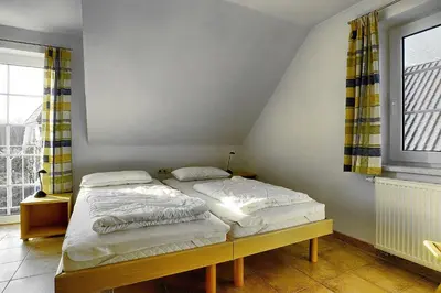 Ein Bett oder Betten in einem Zimmer der Unterkunft Ostseehaus 2