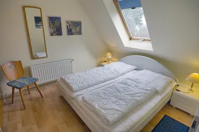 Ein Bett oder Betten in einem Zimmer der Unterkunft Kranich VIII, FW 39