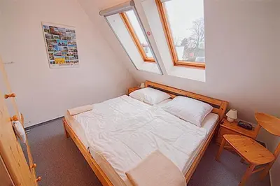 Ein Bett oder Betten in einem Zimmer der Unterkunft Am Bodden, FW 8
