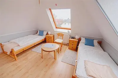 Ein Bett oder Betten in einem Zimmer der Unterkunft Am Bodden, FW 8