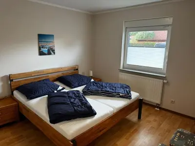 Ein Bett oder Betten in einem Zimmer der Unterkunft Boddenwind FW 1