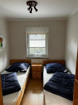 Ein Bett oder Betten in einem Zimmer der Unterkunft Boddenwind FW 1