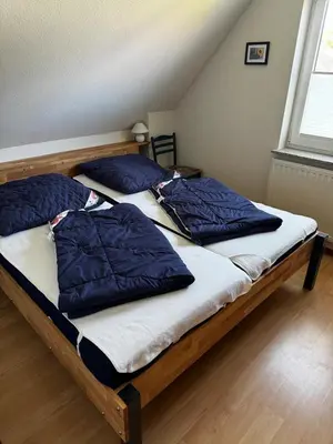 Ein Bett oder Betten in einem Zimmer der Unterkunft Boddenwind FW 2