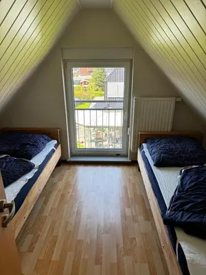 Ein Bett oder Betten in einem Zimmer der Unterkunft Boddenwind FW 2