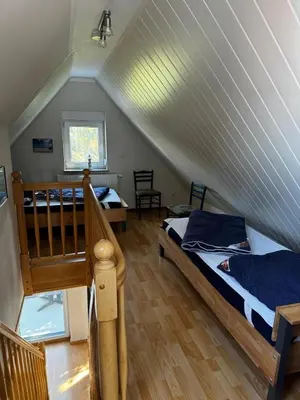 Ein Bett oder Betten in einem Zimmer der Unterkunft Boddenwind FW 2