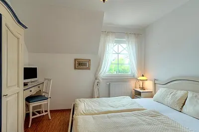 Ein Bett oder Betten in einem Zimmer der Unterkunft Villa Carpe Diem, FW 8