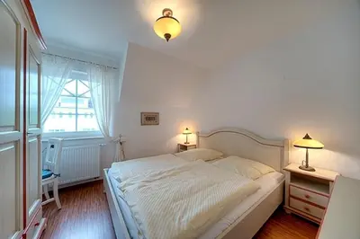 Ein Bett oder Betten in einem Zimmer der Unterkunft Villa Carpe Diem, FW 8