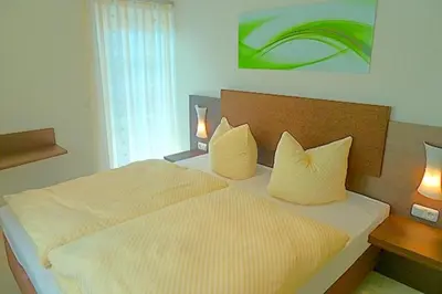Ein Bett oder Betten in einem Zimmer der Unterkunft Strandresidenz Deichgraf 3 Born