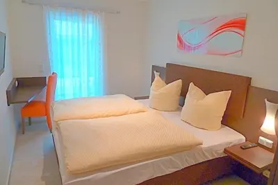 Ein Bett oder Betten in einem Zimmer der Unterkunft Strandresidenz Deichgraf 3 Born