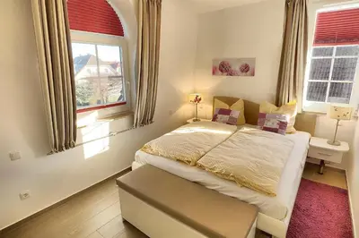 Ein Bett oder Betten in einem Zimmer der Unterkunft Strandresidenz Deichgraf 6 Wustrow
