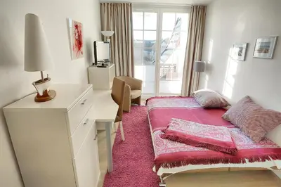 Ein Bett oder Betten in einem Zimmer der Unterkunft Strandresidenz Deichgraf 6 Wustrow