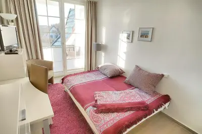 Ein Bett oder Betten in einem Zimmer der Unterkunft Strandresidenz Deichgraf 6 Wustrow