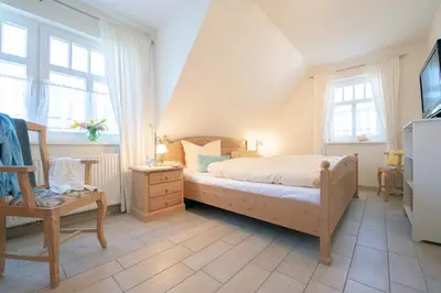 Ein Bett oder Betten in einem Zimmer der Unterkunft Haus Bullerbü