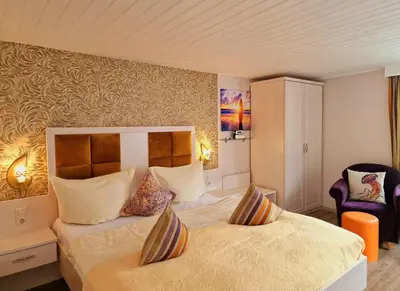 Ein Bett oder Betten in einem Zimmer der Unterkunft Pension Inselparadies Zingst
