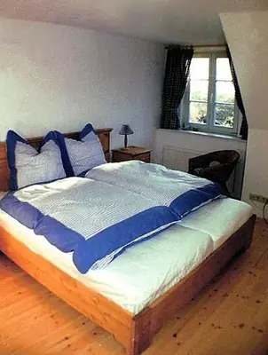 Ein Bett oder Betten in einem Zimmer der Unterkunft Haus Achtern