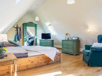 Ein Bett oder Betten in einem Zimmer der Unterkunft min Hüsing
