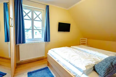 Ein Bett oder Betten in einem Zimmer der Unterkunft Die Kornblume
