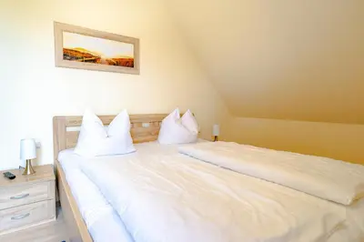Ein Bett oder Betten in einem Zimmer der Unterkunft Die Kornblume